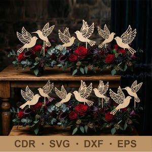 May include: Wooden bird cutouts with intricate wing designs are displayed atop floral arrangements of red roses and greenery. The birds are on wooden sticks, perfect for wedding or event decor. The image also includes the text "CDR • SVG • DXF • EPS".