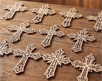 Könnte beinhalten: Eine Sammlung von zehn hellbraunen Holzkreuz-Anhängern mit filigranen, lasergeschnittenen Mustern. Jedes Kreuz hat ein kleines Loch an der Oberseite zum Aufhängen. Der Text CDR, SVG, DXF und EPS ist am unteren Bildrand aufgedruckt.