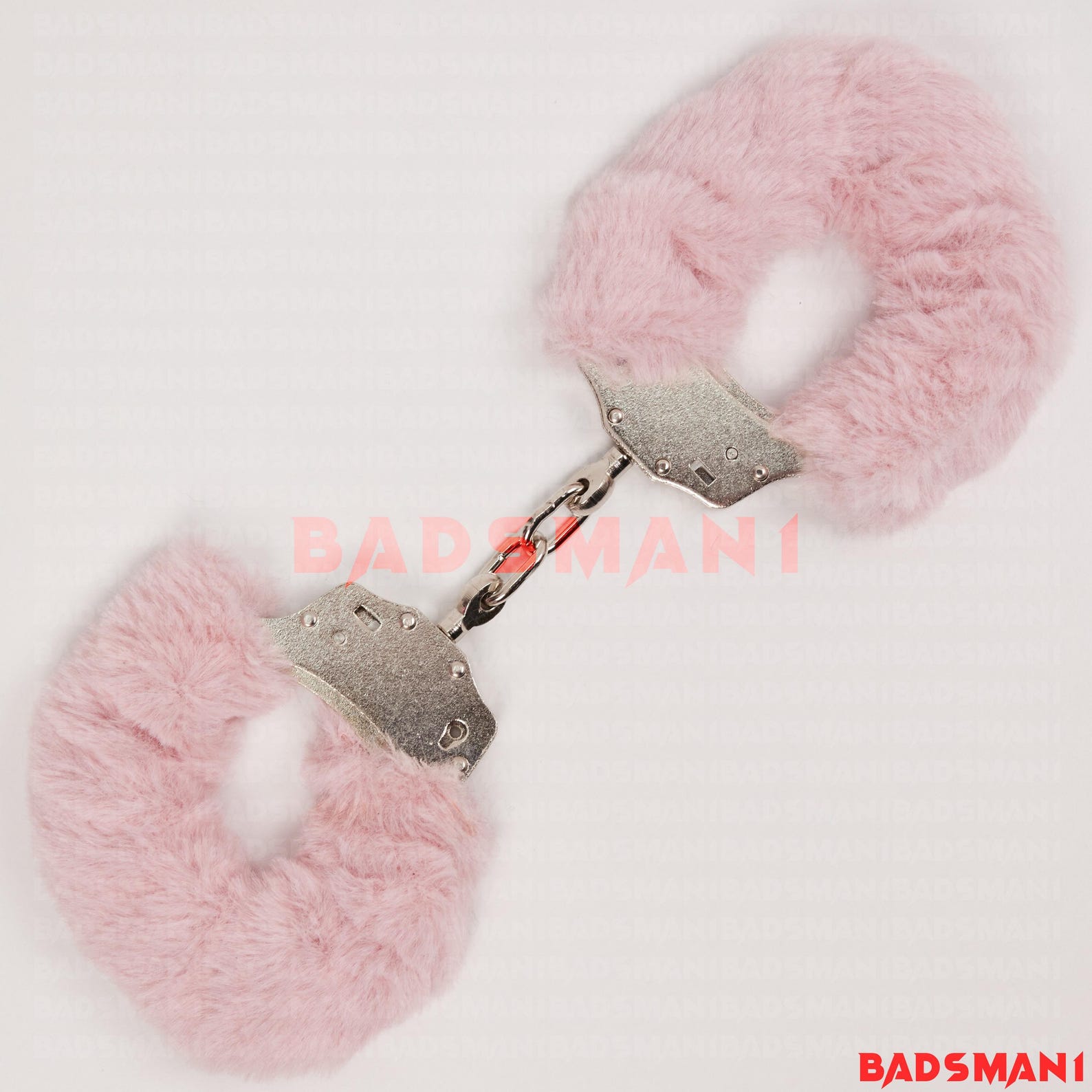 Pink furry BDSM handcuffs with metal chain, ideal bondage restraints for restraint sex or playful kink.