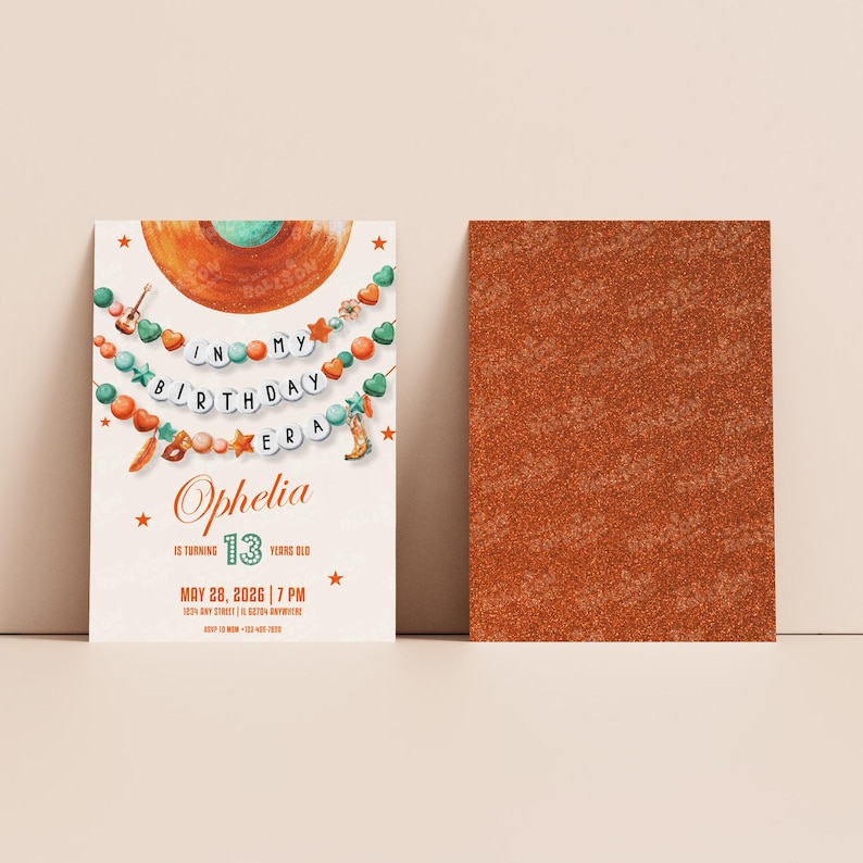 May include: A birthday invitation with a boho theme. The front features text that reads "In My Birthday Era" and "Ophelia 13 Years Old". The back is a solid orange glitter texture. The invitation has a cream background with orange, green, and turquoise accents.