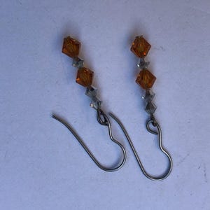 Sparkling Multi-faceted Swarovski Crystal Earrings, Orange and Clear Crystals.