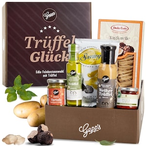 Könnte beinhalten: Eine Geschenkbox mit verschiedenen Trüffel-Gourmet-Artikeln. Enthält eine Packung Pasta, Kartoffelchips, Olivenöl, Saucen, Pesto und frische Trüffel. Die Box ist braun und trägt den Text "Trüffel Glück".