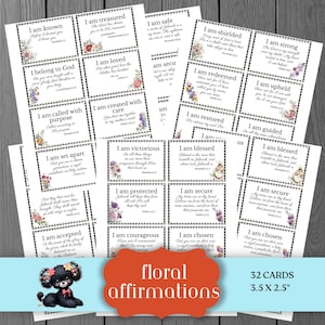 May include: A collection of 32 floral affirmation cards, each 3.5 x 2.5 inches. The cards feature inspirational phrases like "I am loved" and "I am strong," with floral accents. A cute poodle illustration and the words "floral affirmations" are also visible.