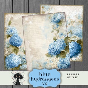 Puede incluir: Tres hojas de papel con un diseño vintage con hortensias azules y detalles de encaje. El texto "blue hydrangeas v2" se muestra en una etiqueta azul, con las dimensiones de los papeles de 21,6 cm x 27,9 cm.