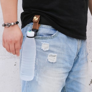 120BOTTLESTRAPLEA Leather bottle holder with straps - Small Leather Goods -  Maje.com