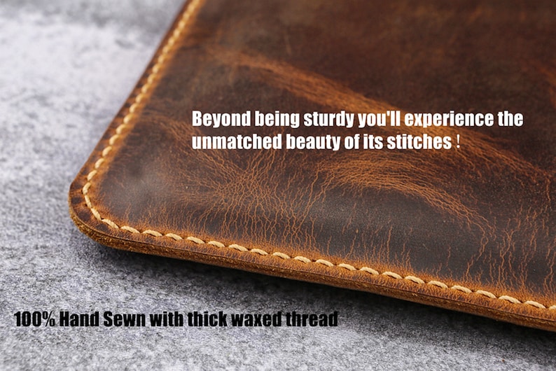 May include: Close-up of a brown leather pouch with a stitched edge. The text "Beyond being sturdy you'll experience the unmatched beauty of its stitches! 100% Hand Sewn with thick waxed thread" is visible.