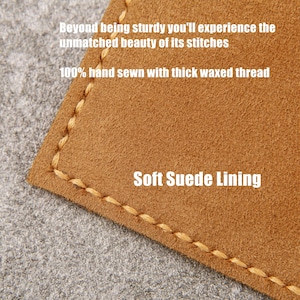 May include: Close-up of a brown leather surface with a stitched edge. The text "Soft Suede Lining" is visible. The leather is described as being sturdy and hand-sewn with thick waxed thread.