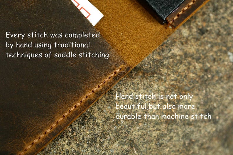 May include: Close-up of a brown leather surface with a stitched edge. The text "Every stitch was completed by hand using traditional techniques of saddle stitching" is visible. The text "Hand stitch is not only beautiful, but also more durable than machine stitch" is also visible.