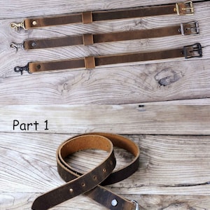 May include: Three brown leather straps with metal clasps and a swivel hook. The straps are arranged in a row, with the top strap having a gold clasp, the middle strap having a silver clasp, and the bottom strap having a black clasp. The straps are on a wooden surface. Part 2 is written above the straps. Below the straps, a brown leather strap with a swivel hook is shown on a wooden surface. Part 1 is written above the strap.