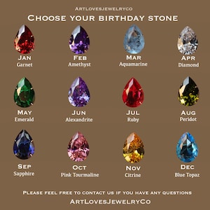 May include: A chart showing the birthstones for each month of the year. The chart features a teardrop-shaped gemstone for each month, with the name of the month and the gemstone below each image. The gemstones are: Garnet, Amethyst, Aquamarine, Diamond, Emerald, Alexandrite, Ruby, Peridot, Sapphire, Pink Tourmaline, Citrine, and Blue Topaz.