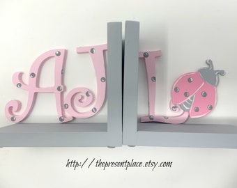 initial bookends with lady bugs in pink and grey