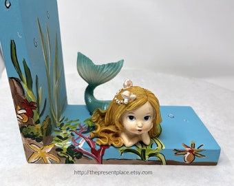 mermaid bookends with a thoughtful mermaid