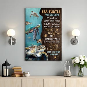 May include: A framed canvas print featuring sea turtles swimming in an ocean scene. The artwork includes the text "SEA TURTLE WISDOM" with inspirational phrases like "Trust the flow" and "Enjoy time alone."
