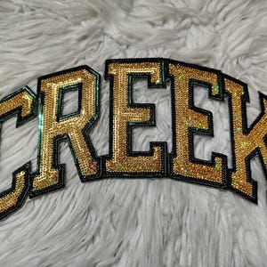 Toppe termoadesive in paillettes e ciniglia: mascotte, loghi e nomi della tua squadra