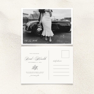 May include: Black and white save the date postcard with a photo of a couple standing in front of a classic car. The text reads "Save Our Date, Derek & Meredith, September 15, 2026".