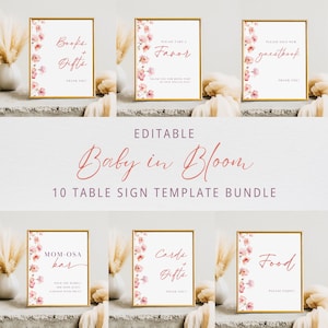 May include: Ten printable table signs for a baby shower. The signs feature pink floral designs and gold frames. The signs include: Books & Gifts, Please Take a Favor, Please Sign Our Guestbook, Mom-osa Bar, Cards & Gifts, and Food.