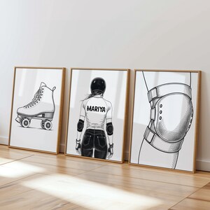 May include: A set of three framed art prints with roller derby-themed illustrations. One shows a roller skate, another a person in protective gear with the name "MARIYA", and the third a knee pad.