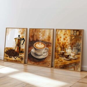 以下が含まれることがあります： コーヒーをテーマにした、額装された3つの水彩画のセット。1つはコーヒーメーカーと豆、もう1つはハートアートのラテ、3つ目はカップとティーポットのあるコーヒーサービスです。このアートワークは、暖かく魅力的な色使いです。