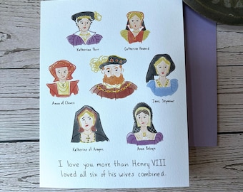 May include: A white greeting card featuring a watercolor illustration of King Henry VIII surrounded by his six wives, each labeled with their name. The text at the bottom reads, I love you more than Henry VIII loved all six of his wives combined.