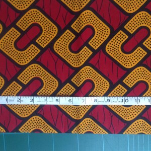 Quarto di grasso stampato in cotone Julius Holland geometrico rosso e oro africano