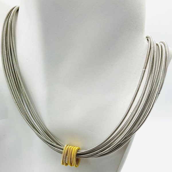 Piano wire  multi strand and gold coils  necklace