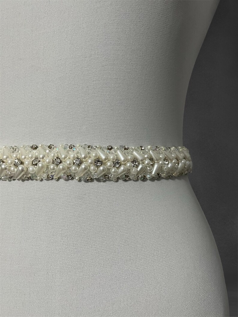 Full view of the bridal belt, highlighting its graceful design and shimmering details. A stunning addition to any wedding dress for a touch of timeless beauty.