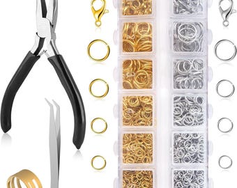 May include: Jewelry-making tools and supplies are displayed. The image shows a set of pliers, tweezers, and a variety of gold and silver jump rings, clasps, and a ring. The jump rings are organized in a clear plastic container.