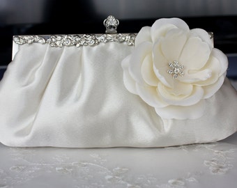 Ivory satin bridal clutch purse with flower