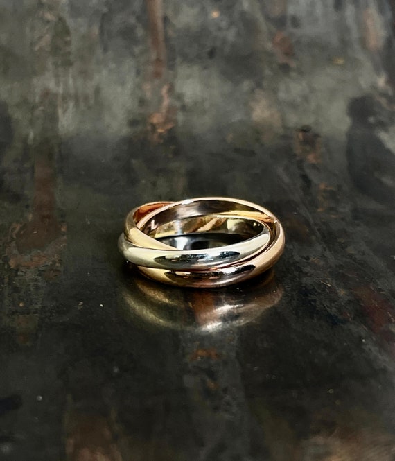 Spin Band Ring with Tri Tone Bands Yellow and Rose Gold Over Sterling Silver Spin Band Ring with Tri Tone Bands Yellow and Rose Gold Over Sterling Silver
