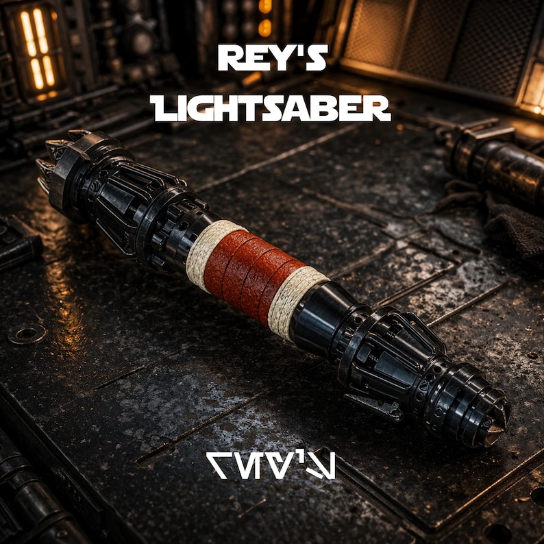 May include: A black and silver lightsaber with a red and tan grip. The text "REY'S LIGHTSABER" is displayed above the lightsaber. The lightsaber is on a dark, textured surface. The text "REY'S" is displayed below the lightsaber.