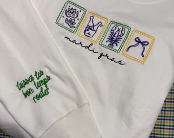 Mardi Gras coquette sweatshirt . Embroidered with “Laissez les bon temps rouler” on the sleeve.