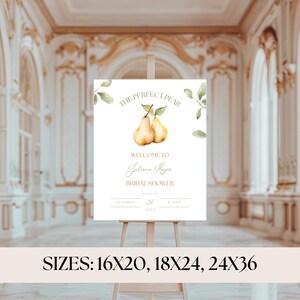 May include: A white sign on an easel with the text "THE PERFECT PEAR" and "WELCOME TO Juliana Hayes BRIDAL SHOWER". The sign features watercolor illustrations of pears and greenery. The bottom of the sign reads "SIZES: 16X20, 18X24, 24X36".