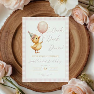 May include: A birthday invitation featuring a watercolor illustration of a yellow duckling holding a pink balloon. The invitation has a pink and white gingham border and includes the text "Duck, Duck, Dence!" and details for Isabelle's 2nd birthday.