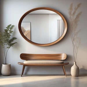 May include: A wooden bench with a light brown cushion sits in front of a large, round wooden mirror with a reflective surface. A potted plant and a vase with dried flowers are on either side of the bench.