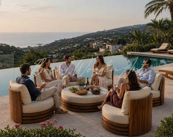 May include: Outdoor seating area with a group of people enjoying drinks and snacks. The scene includes a round coffee table, comfortable armchairs, and a swimming pool overlooking the ocean. Palm trees and lush greenery add to the ambiance.