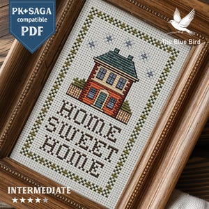 May include: Cross-stitch pattern of a house with the text "HOME SWEET HOME" in a wooden frame. The house is red brick with a green roof and blue windows. The pattern is labeled "Intermediate" and includes the text "PK+SAGA compatible PDF".
