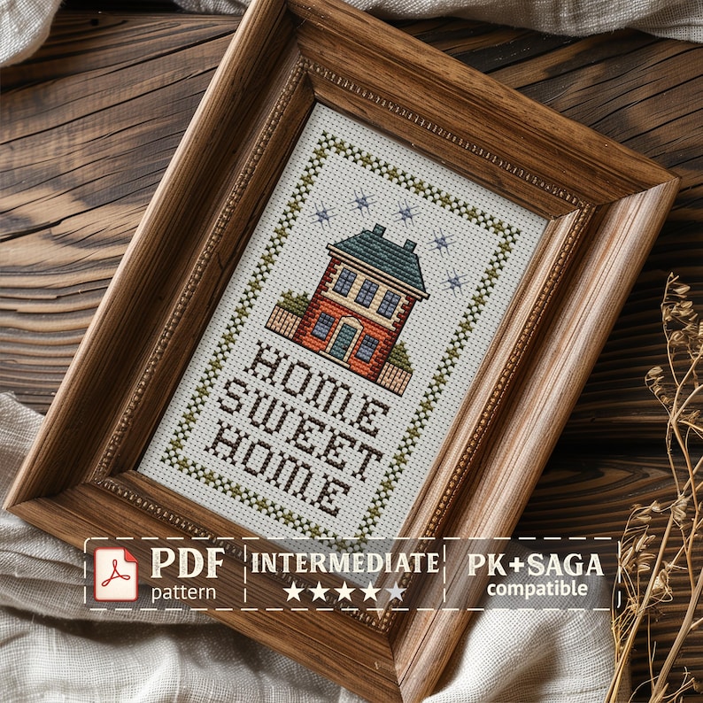 May include: Cross-stitch pattern of a house with the text "HOME SWEET HOME" in a wooden frame. The house is red brick with a green roof and blue windows. The pattern is labeled "Intermediate" and includes the text "PK+SAGA compatible PDF".