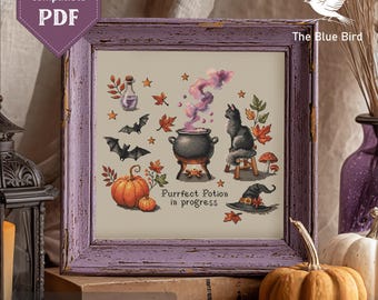 May include: A framed cross-stitch pattern with a Halloween theme. The design features a cauldron, black cat, pumpkins, bats, and a witch's hat. Text includes "Purrfect Potion in progress" and "The Blue Bird". The frame is a distressed purple.