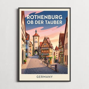 以下が含まれることがあります： ドイツのローテンブルク・オプ・デア・タウバーを描いたカラフルなイラストの額入りトラベルポスター。石畳の通り、木組みの建物、時計塔、夕焼けの空が描かれています。テキストには「ROTHENBURG OB DER TAUBER」および「GERMANY」と記されています。