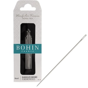 May include: A packet of Bohin France sashiko needles, with the text "Manufacture Française Depuis 1833". The packet contains 8 needles. A single needle is shown to the right. The needles are silver and have an eye at one end.