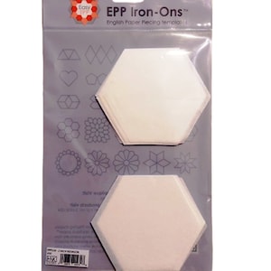 May include: A packet of EPP Iron-Ons English Paper Piecing templates. The clear packaging has a grey backing, displaying geometric and floral design examples. Two large, white, hexagon-shaped templates are visible.