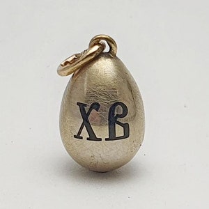 Authentic antique gold and silver egg pendant with enamel by Faberge.