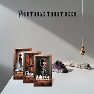 May include: Three framed tarot cards with the words "Mirror" and "Flat" printed on them. The cards have a brown and black frame. The words "Printable Tarot Deck" are printed at the top of the image. A purple crystal and a bundle of sage are also visible.