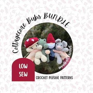 May include: A bundle of four crocheted plushies: a mushroom, frog, gnome, and mouse. The mushroom has a red cap with white spots. The frog is green, the gnome has a red hat, and the mouse is gray. The text reads "Cottagecore Bubs Bundle" and "Crochet Plushie Patterns."