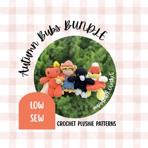 May include: Four crocheted plushies in a bundle, including an orange pumpkin, a scarecrow, a black crow, and a candy corn figure. The text reads Autumn Bubs Bundle, Low Sew, and Crochet Plushie Patterns. The figures are soft, yarn-based toys.