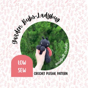 May include: A small, dark gray crocheted ladybug plushie with a red wing detail. The text on the image reads Garden Bubs-Ladybug, LOW SEW, CROCHET PLUSHIE PATTERN, and @audball_crochet. The plushie features two small antennae and white stitched eyes.