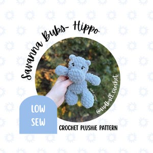 May include: A crocheted gray hippo plushie held in a hand, with the text "Savanna Bubs - Hippo" and "Crochet Plushie Pattern". A light blue banner reads "Low Sew". The plushie has small black eyes and a textured surface.