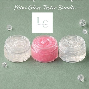 May include: A set of three ceramic mugs with a speckled, matte finish. The mugs are in shades of cream, light gray, and dark gray. Each mug has a simple, minimalist design and a rounded handle.