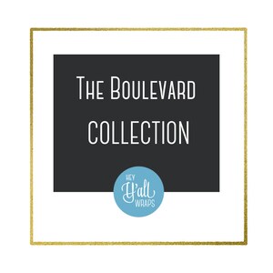 May include: A gold frame with a black background and white text that reads "The Boulevard Collection" and a blue circle with white text that reads "Hey Y'all Wraps".