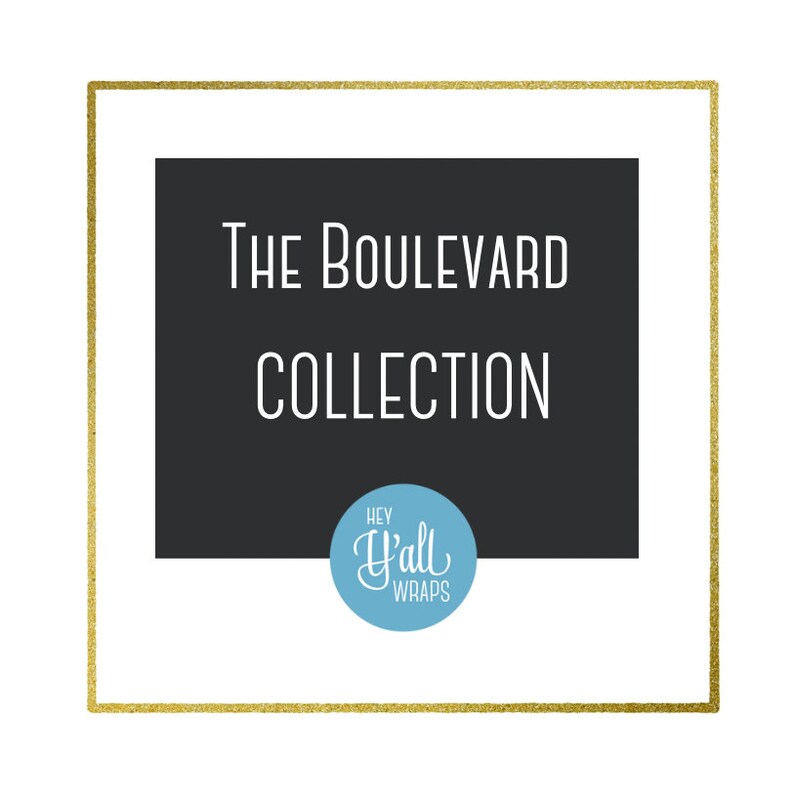 May include: A gold frame with a black background and white text that reads "The Boulevard Collection" and a blue circle with white text that reads "Hey Y'all Wraps".